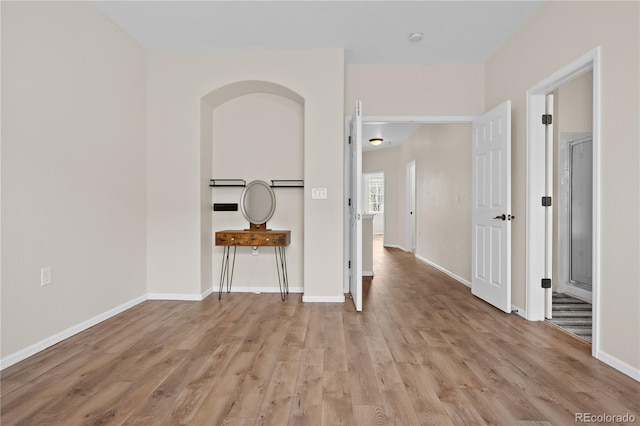 hall with light hardwood / wood-style floors