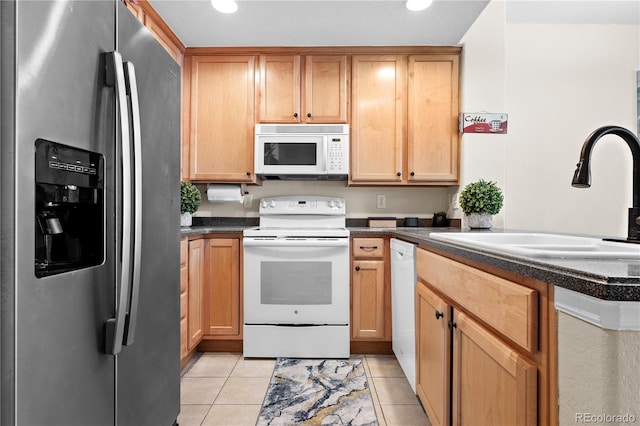 15945 E Geddes Dr Unit 54, Aurora, CO 80016 - kitchen featuring white appliances, dark countertops, light tile patterned flooring, and recessed lighting