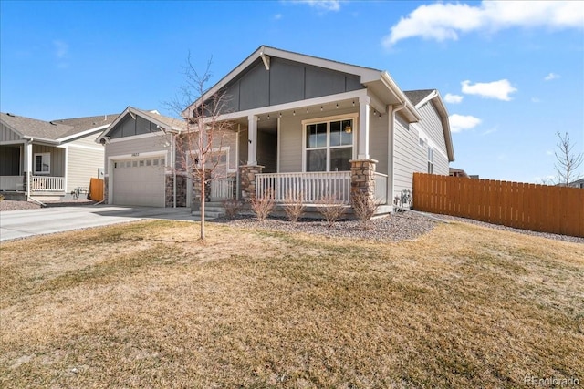 craftsman house featuring a porch, concrete driveway, board and batten siding, and a garage