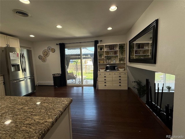 7132 Xavier Way, Westminster, CO 80030 - kitchen featuring stainless steel refrigerator with ice dispenser, a baseboard heating unit, dark wood finished floors, recessed lighting, and dark stone countertops