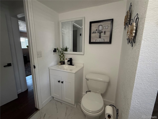 7132 Xavier Way, Westminster, CO 80030 - half bathroom with vanity and marble look tiles