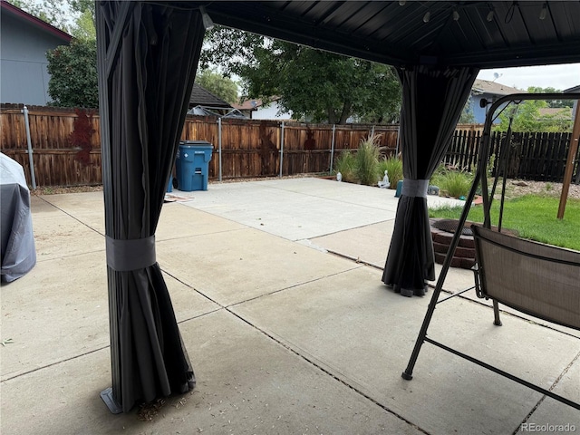 7132 Xavier Way, Westminster, CO 80030 - fenced backyard with a patio and a gazebo