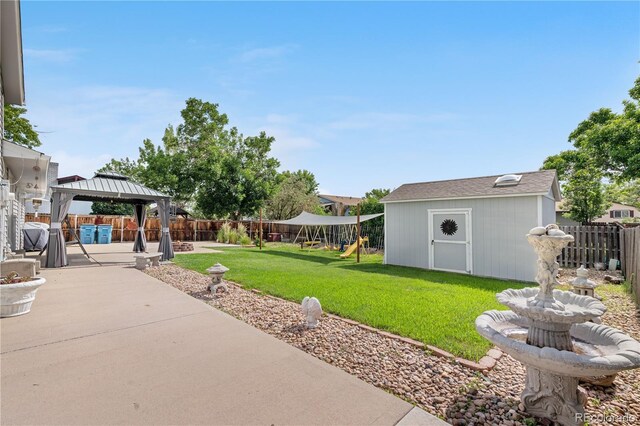 7132 Xavier Way, Westminster, CO 80030 - fenced backyard featuring a playground, a patio, a gazebo, and a storage shed