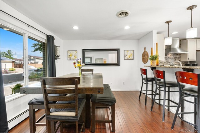 7132 Xavier Way, Westminster, CO 80030 - dining area with dark wood-type flooring and recessed lighting