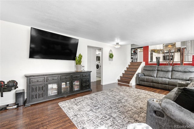 7132 Xavier Way, Westminster, CO 80030 - living room with washer / dryer, dark wood-style floors, and stairway