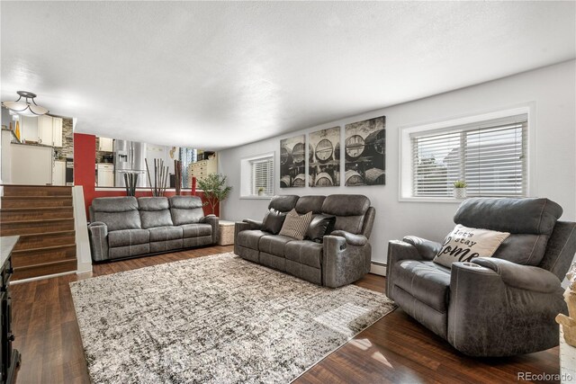 7132 Xavier Way, Westminster, CO 80030 - living room featuring dark wood finished floors and baseboard heating