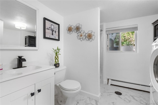 7132 Xavier Way, Westminster, CO 80030 - full bathroom with a baseboard heating unit, marble finish floors, vanity, washer / clothes dryer, and a shower with curtain