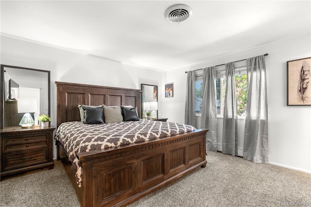 7132 Xavier Way, Westminster, CO 80030 - bedroom with light colored carpet and a baseboard heating unit