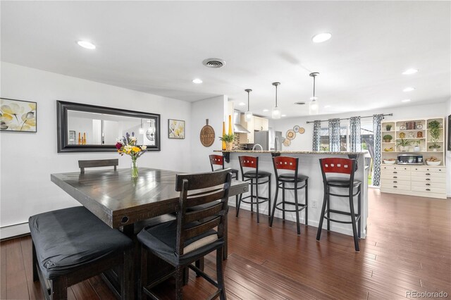 7132 Xavier Way, Westminster, CO 80030 - dining space with recessed lighting, dark wood-style flooring, and a baseboard radiator