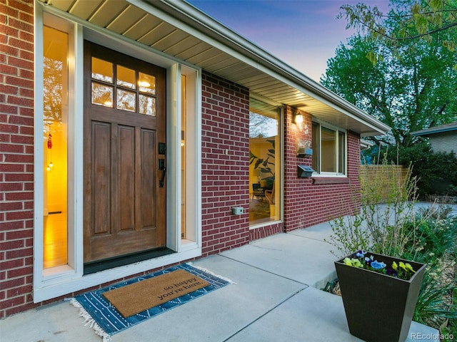 207 Iowa Dr, Golden, CO 80403 - exterior entry at dusk featuring brick siding