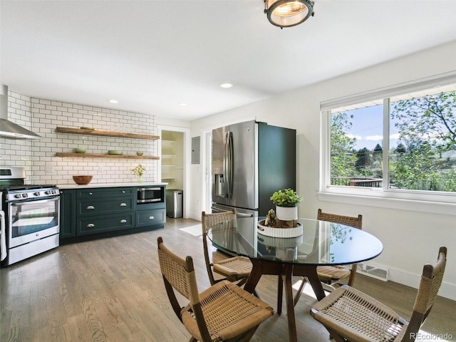 207 Iowa Dr, Golden, CO 80403 - dining room with light wood-type flooring, baseboards, electric panel, and recessed lighting