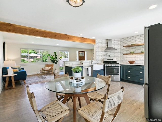 207 Iowa Dr, Golden, CO 80403 - dining space featuring light wood-style flooring, recessed lighting, baseboards, and beamed ceiling