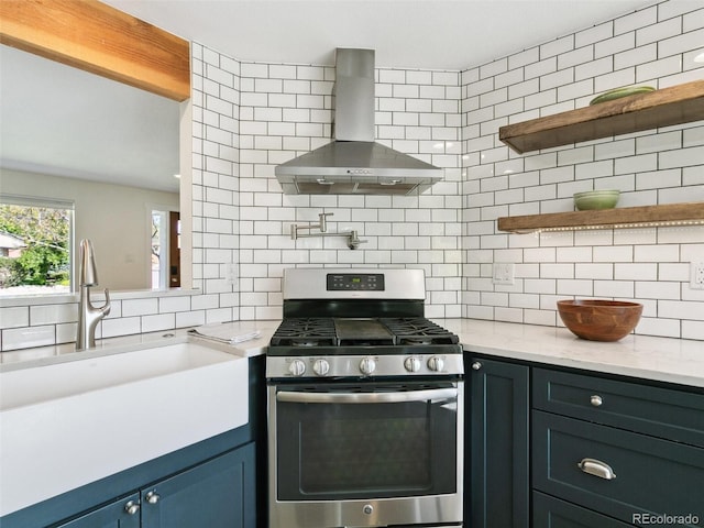 207 Iowa Dr, Golden, CO 80403 - kitchen featuring stainless steel range with gas cooktop, wall chimney exhaust hood, backsplash, a sink, and open shelves