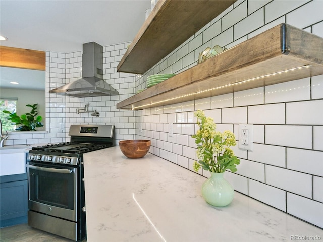207 Iowa Dr, Golden, CO 80403 - kitchen featuring gas stove, wall chimney range hood, backsplash, and open shelves