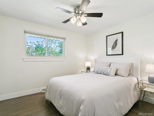 207 Iowa Dr, Golden, CO 80403 - bedroom with baseboards, dark wood-style flooring, and a ceiling fan