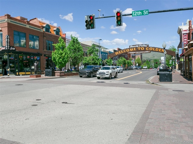 207 Iowa Dr, Golden, CO 80403 - view of asphalt road featuring street lighting, sidewalks, curbs, and traffic lights