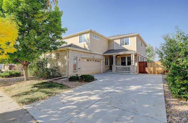 view of front of home featuring a porch and a garage