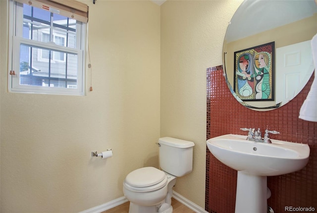 bathroom featuring toilet and sink