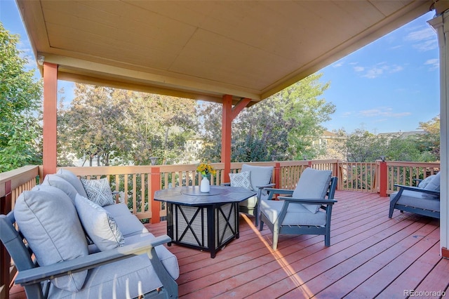 wooden terrace featuring an outdoor living space