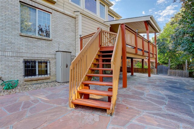 exterior space featuring a patio area and a wooden deck