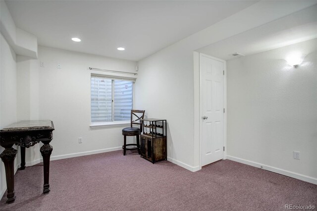 living area with carpet