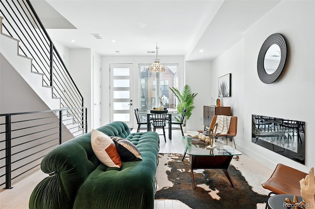 4394 Zenobia St, Denver, CO 80212 - living room with wood finished floors, stairway, a chandelier, and recessed lighting