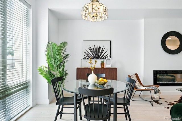4394 Zenobia St, Denver, CO 80212 - dining space featuring wood finished floors and a glass covered fireplace