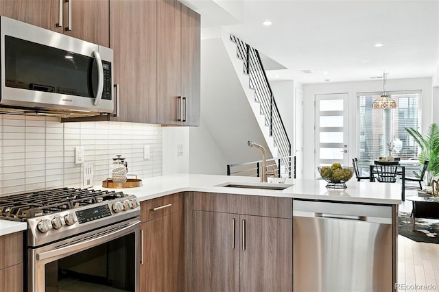 4394 Zenobia St, Denver, CO 80212 - kitchen featuring stainless steel appliances, modern cabinets, and recessed lighting