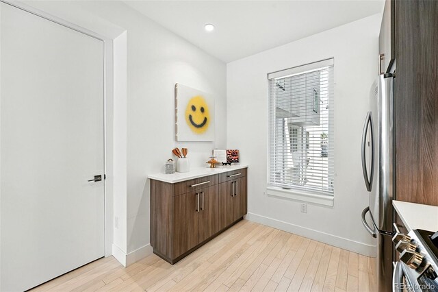 4394 Zenobia St, Denver, CO 80212 - kitchen with stainless steel appliances, light countertops, light wood-style flooring, and recessed lighting