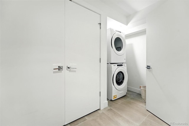 4394 Zenobia St, Denver, CO 80212 - laundry room featuring stacked washer / drying machine and light tile patterned floors