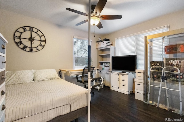 bedroom featuring dark wood finished floors and a ceiling fan