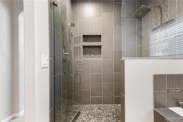 bathroom featuring a stall shower