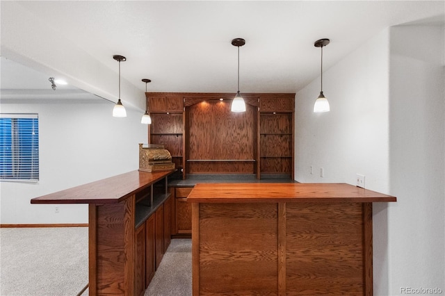 bar featuring carpet floors and decorative light fixtures