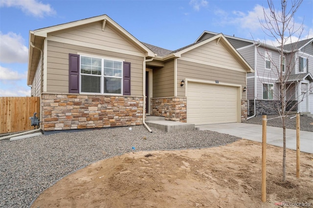 874 Ledge St, Lochbuie, CO 80603 - craftsman house featuring stone siding, concrete driveway, and a garage