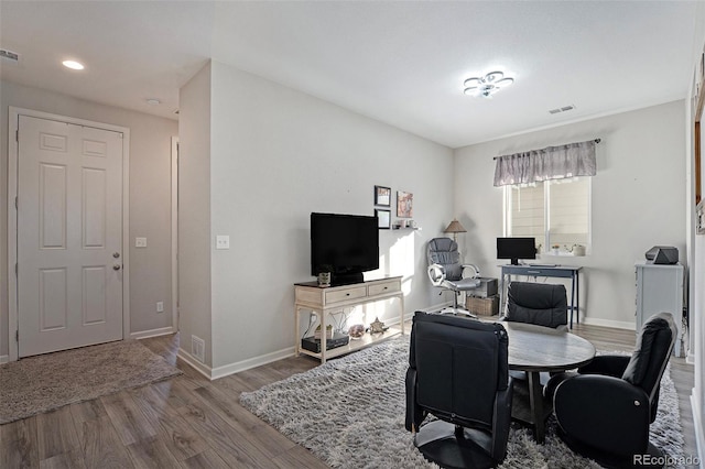 home office with hardwood / wood-style floors