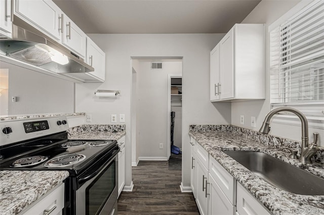 kitchen featuring under cabinet range hood, a sink, visible vents, white cabinets, and stainless steel electric range