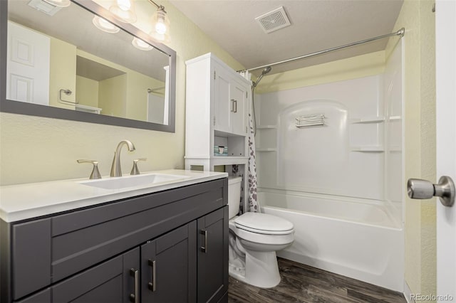 full bathroom featuring toilet, shower / bath combo with shower curtain, wood finished floors, and visible vents