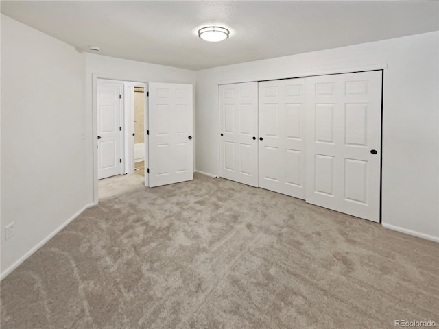 12444 E Tennessee Cir Unit A, Aurora, CO 80012 - unfurnished bedroom with carpet flooring and a closet