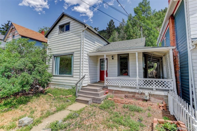 1324 Virginia St, Idaho Springs, CO 80452 - shotgun-style home with a porch