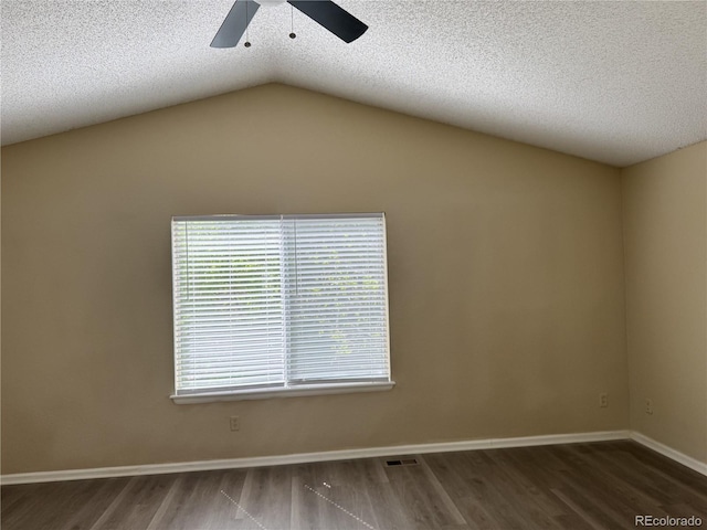 4338 N Ceylon Ct, Denver, CO 80249 - empty room featuring a ceiling fan, wood finished floors, a textured ceiling, vaulted ceiling, and baseboards