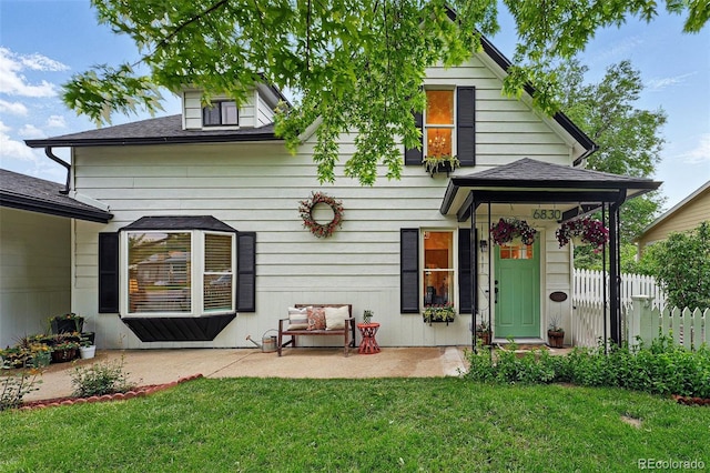 6830 Lamar St, Arvada, CO 80003 - rear view of property featuring a patio area and a shingled roof