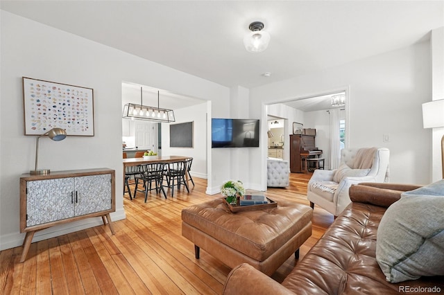 6830 Lamar St, Arvada, CO 80003 - living room featuring wood-type flooring and baseboards