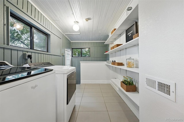 6830 Lamar St, Arvada, CO 80003 - laundry room featuring washing machine and dryer and light tile patterned floors