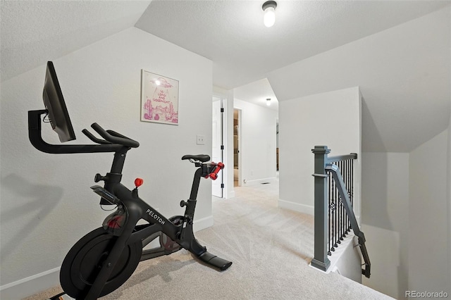 6830 Lamar St, Arvada, CO 80003 - exercise room with vaulted ceiling, carpet floors, and baseboards