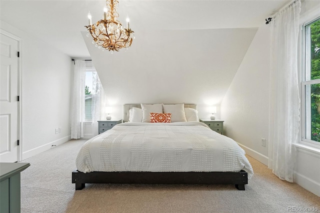 6830 Lamar St, Arvada, CO 80003 - bedroom featuring light colored carpet, a chandelier, multiple windows, and baseboards