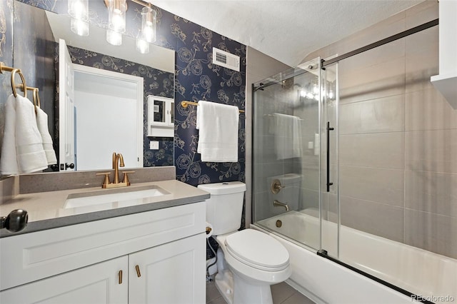 6830 Lamar St, Arvada, CO 80003 - bathroom with wallpapered walls, toilet, vanity, enclosed tub / shower combo, and a textured ceiling