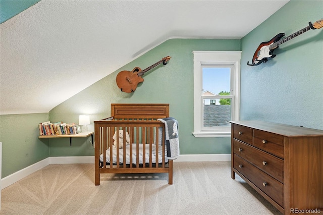 6830 Lamar St, Arvada, CO 80003 - bedroom with lofted ceiling, carpet flooring, baseboards, a textured ceiling, and a nursery area