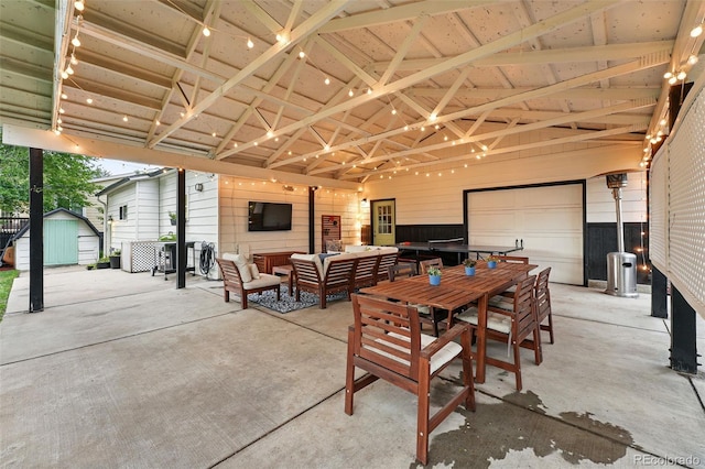6830 Lamar St, Arvada, CO 80003 - view of patio / terrace with an outdoor hangout area, a garage, a carport, and outdoor dining area