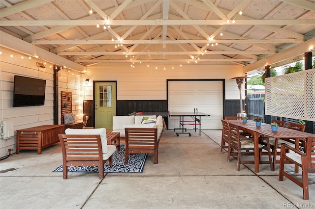 6830 Lamar St, Arvada, CO 80003 - view of patio with a garage, outdoor dining space, and an outdoor living space