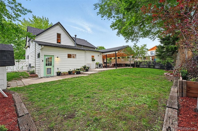 6830 Lamar St, Arvada, CO 80003 - rear view of house with a patio and roof with shingles